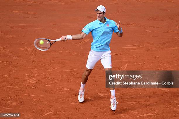 Novak Djokovic of Serbia returns a shot during his men's singles final match against Rafael Nadal of Spain on day fifteen of the French Open at...