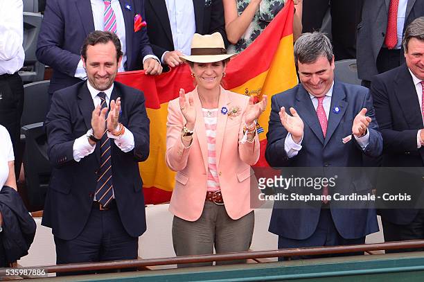 Jose Ramon Bauza Diaz , Infanta Elena of Spain and Miguel Cardenal Carro attend the Men's Final of Roland Garros French Tennis Open 2014 - Day 15 on...