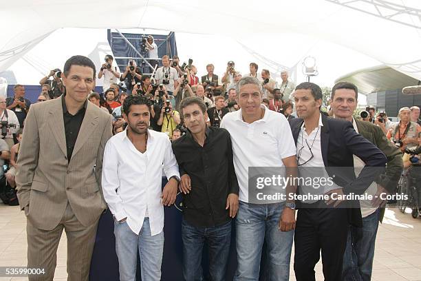 Roschdy Zem, Jamel Debbouze, Rachid Bouchareb, Samy Naceri, Sami Bouajila, and Bernard Bancan at the photo call of "Indigenes" during the 59th Cannes...