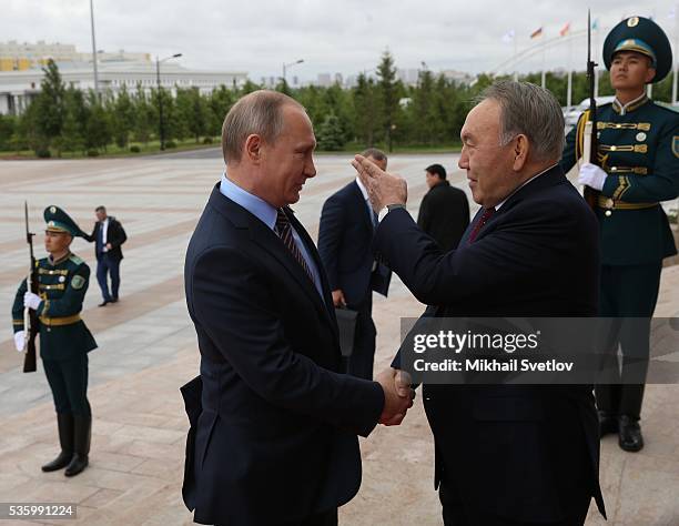 Kazakh President Nursultan Nazarbayev greets Russian President Vladimir Putin at Akorda Palace on May 31, 2016 in Astana, Kazakhstan. Heads of the...