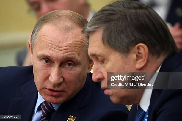 Russian President Vladimir Putin talks to Presidential Aide Yuri Ushakov during the Eurasian Economic Union Summit at Akorda Palace on May 31, 2016...