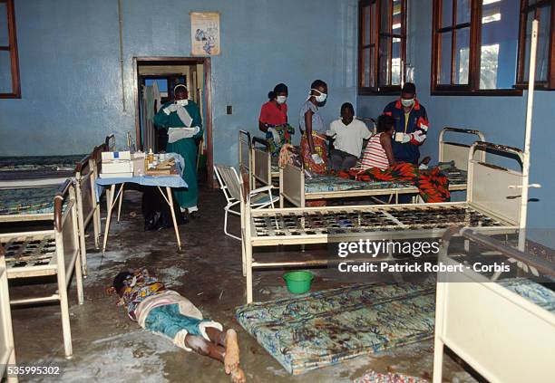 The body of an Ebola virus victim lies on the floor of a ward in Kikwit General Hospital among stripped beds and filthy mattresses. The 1995 Ebola...
