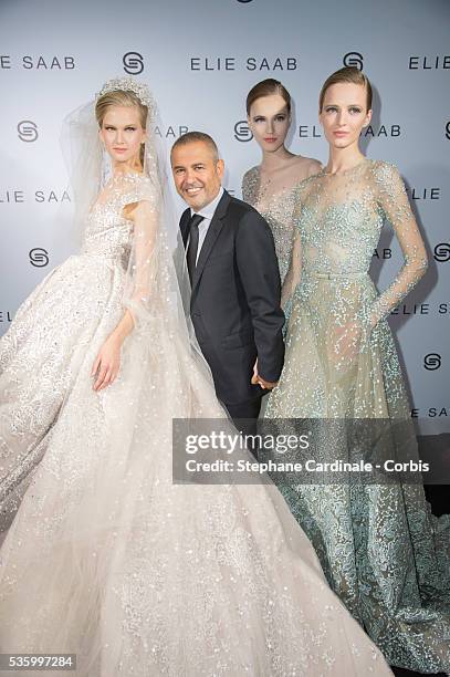 Elie Saab with the models in backstage at the Elie Saab show during the Paris Fashion Week - Haute Couture Fall/Winter 2014-2015