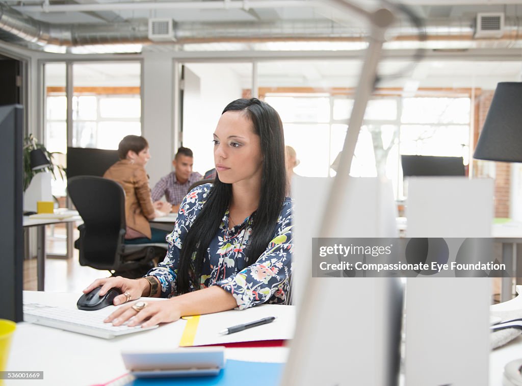 Businesswoman working on computer in office