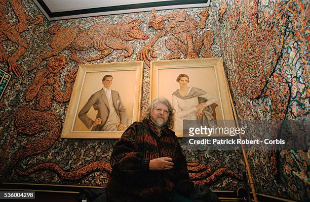 Lord Alexander Thynn, 7th Marquess of Bath, stands next to two portraits in a room he has decorated with a mural at Longleat House. Lord Thynn...