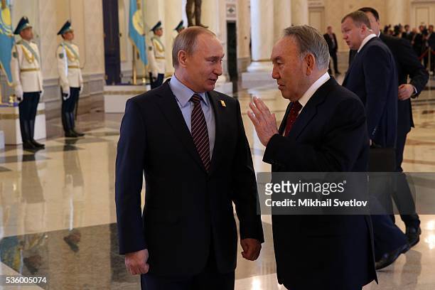 Russian President Vladimir Putin and Kazakh President Nursultan Nazarbayev arrive to the Eurasian Economic Union Summit at Akorda Palace on May 31,...