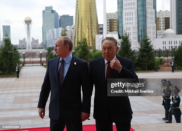 Russian President Vladimir Putin and Kazakh President Nursultan Nazarbayev arrive to the Eurasian Economic Union Summit at Akorda Palace on May 31,...