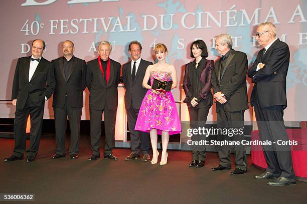 Jessica Chastain pose after receiving a tribute with Jury's members Pierre Lescure, Jean-Pierre Jeunet, Costa Gavras, Vincent Lindon, Marie-Claude...