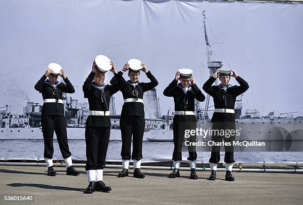 Sea Cadets prepare for a service at HMS Caroline in front of a banner of the ship on May 31, 2016 in Belfast, Northern Ireland. HMS Caroline is the...