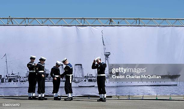 Sea Cadets prepare for a service at HMS Caroline in front of a banner of the ship on May 31, 2016 in Belfast, Northern Ireland.HMS Caroline is the...