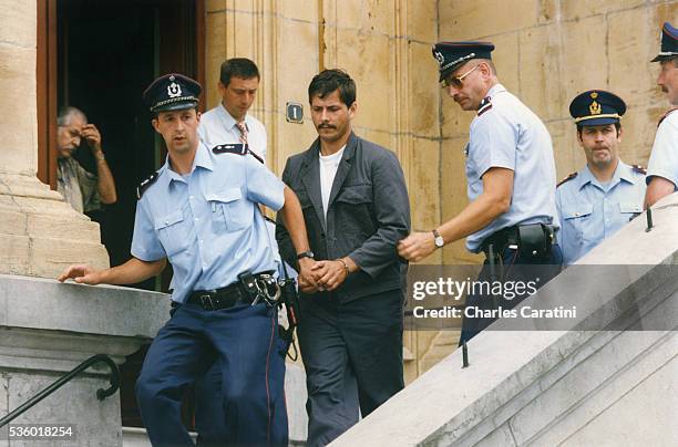 Belgian child rapist Marc Dutroux leaves the court of justice of Neufchateau.