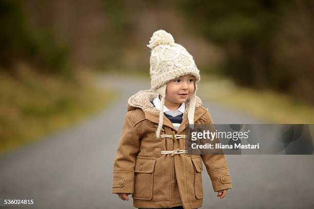 on the road - duffle coat stock pictures, royalty-free photos & images