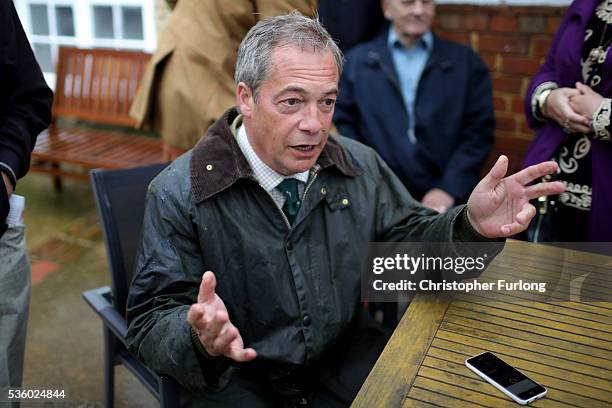 Leader Nigel Farage talks to the media after his planned trip to Northampton was cancelled amid protests in the city centre on May 31, 2016 in...