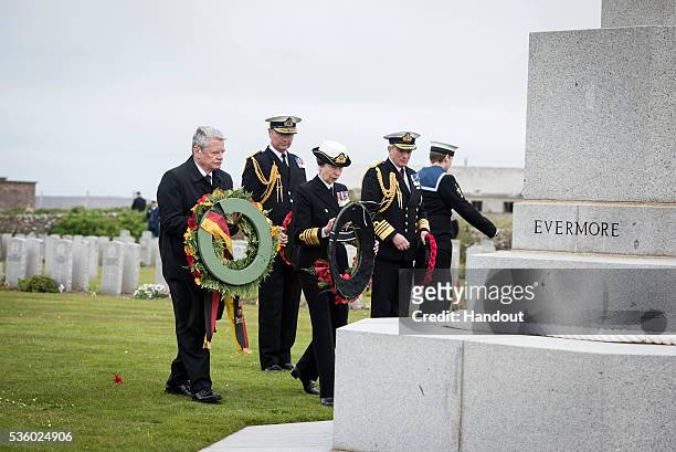 In this handout photo provided by the German Government Press Office , German President Joachim Gauck and Princess Anne, Princess Royal lay wreaths...
