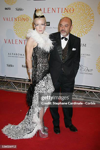 Daphne Guiness and Christian Louboutin arrive at the Valentino's gala dinner held at Villa Borghese in Rome.