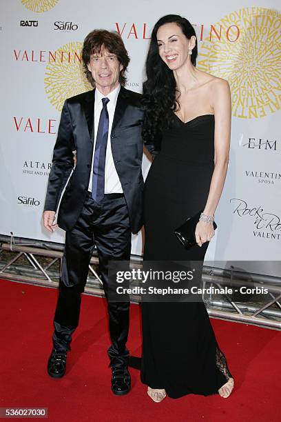 Mick Jagger and L'Wren Scott arrive at the Valentino's gala dinner held at Villa Borghese in Rome.