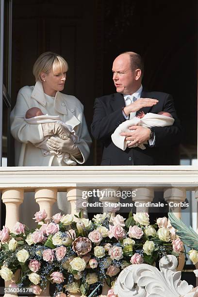 Prince Albert II of Monaco and Princess Charlene of Monaco pose with Prince Jacques and Princess Gabriella on the Balcony of the Monaco Palace on...