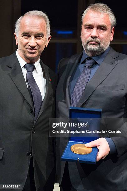 Alain Terzian and Director Luc Besson pose with the first 'Gold Medal of the Academy of Arts and Techniques of Cinema' held at Monnaie De Paris on...