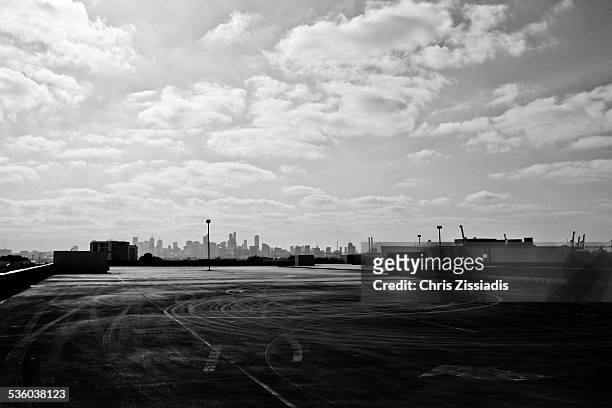city skyline from suburban car park rooftop - melbourne rooftop parking ストックフォトと画像