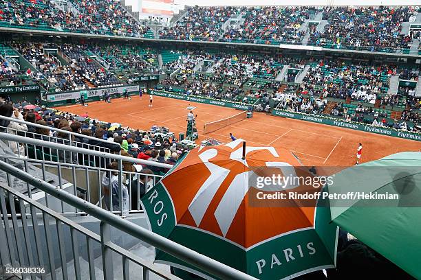 General ambiance of atmosphere of a rainy day with umbrellas in the court Chatrier pictured during the match between Novak Djokovic and Roberto...