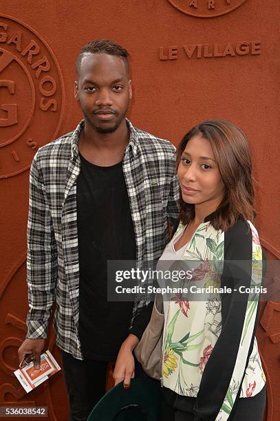 Actor Ahmed Drame and guest attend day ten of the 2016 French Open at Roland Garros on May 31, 2016 in Paris, France.
