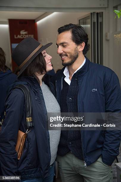Actress Louise Monot and her companion actor Samir Boitar attend day ten of the 2016 French Open at Roland Garros on May 31, 2016 in Paris, France.