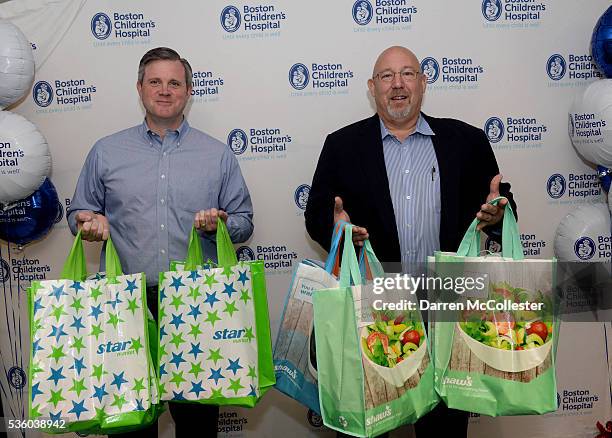 Russ Greenlaw, Director Of Operations, Star Market, and Paul Gossett, President, Shaw's Supermarkets, deliver healthy snacks to kids for the Shaw's &...