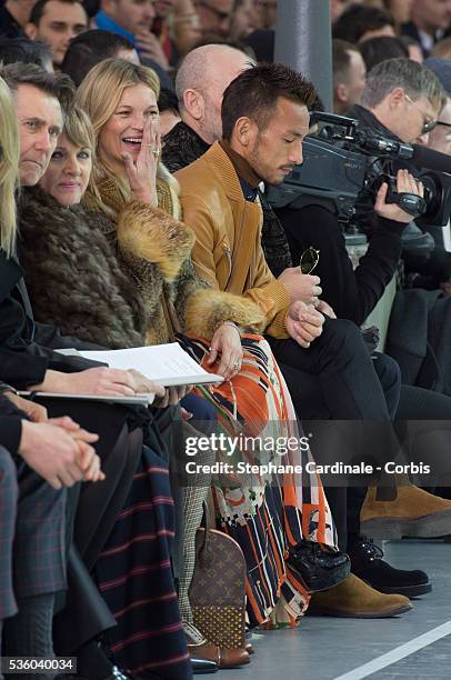 Kate Moss and Hidetoshi Nakata attend the Louis Vuitton Menswear Fall/Winter 2015-2016 show as part of Paris Fashion Week on January 22, 2015 in...