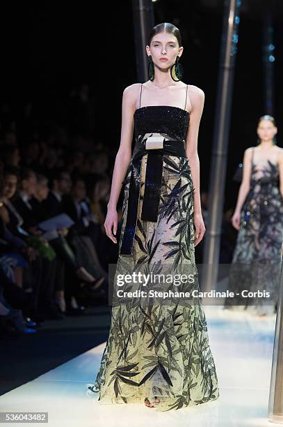 Model walks the runway during the Giorgio Armani Prive show as part of Paris Fashion Week Haute Couture Spring/Summer 2015 on January 27, 2015 in...