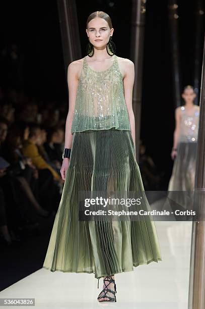 Model walks the runway during the Giorgio Armani Prive show as part of Paris Fashion Week Haute Couture Spring/Summer 2015 on January 27, 2015 in...