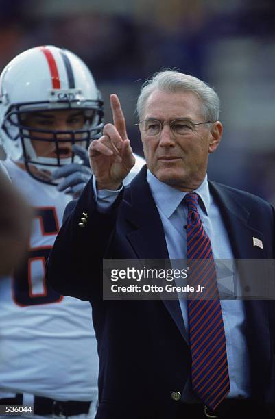 Head Coach John Mackovic of the Arizona Wildcats talks to his team during the game against the Washington Huskies at the Husky Stadium in Seattle,...
