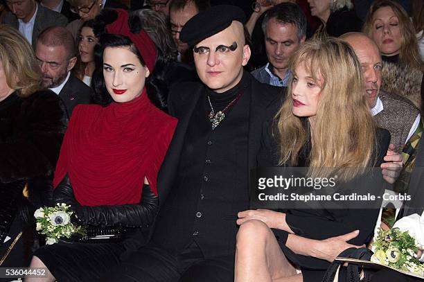 Dita Von Teese, Ali Mahdavi and Arielle Dombasle attend the Jean Paul Gaultier show as part of Paris Fashion Week Haute Couture Spring/Summer 2015 on...