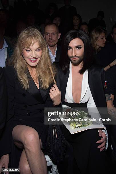Arielle Dombasle and Conchita Wurst attend the Jean Paul Gaultier show as part of Paris Fashion Week Haute Couture Spring/Summer 2015 on January 28,...