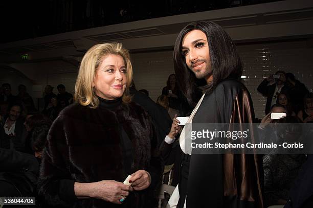 Catherine Deneuve and Conchita Wurst attend the Jean Paul Gaultier show as part of Paris Fashion Week Haute Couture Spring/Summer 2015 on January 28,...