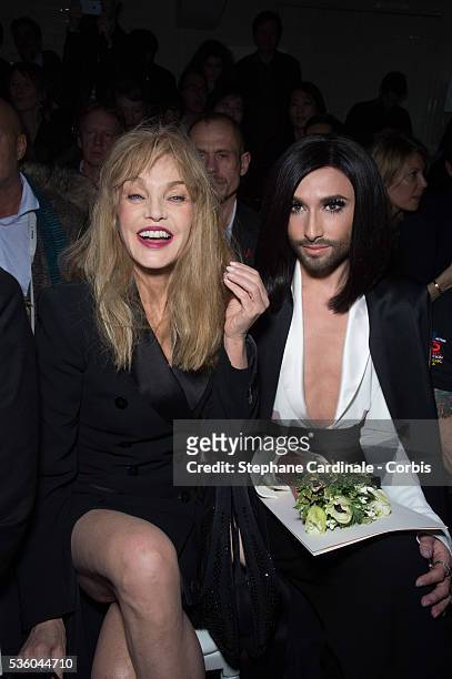 Arielle Dombasle and Conchita Wurst attend the Jean Paul Gaultier show as part of Paris Fashion Week Haute Couture Spring/Summer 2015 on January 28,...