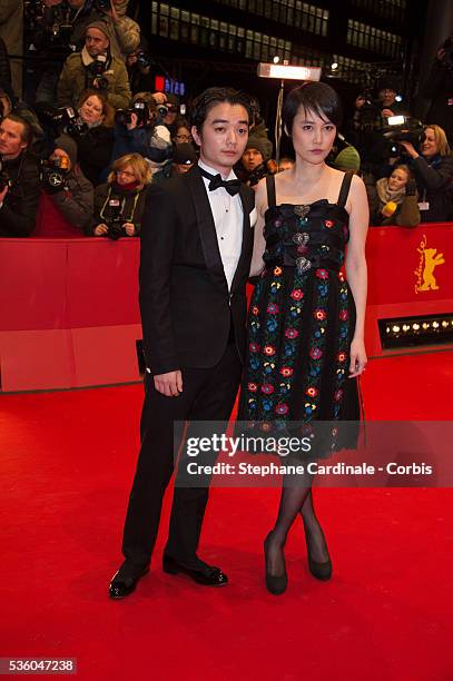 Actress Rinko Kikuchi and her husband actor Shota Sometani attend the 'Nobody Wants the Night' Opening Night premiere during the 65th Berlinale...