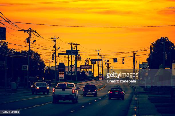 traffic on an american road at sunset, usa - nashville sunrise stock pictures, royalty-free photos & images