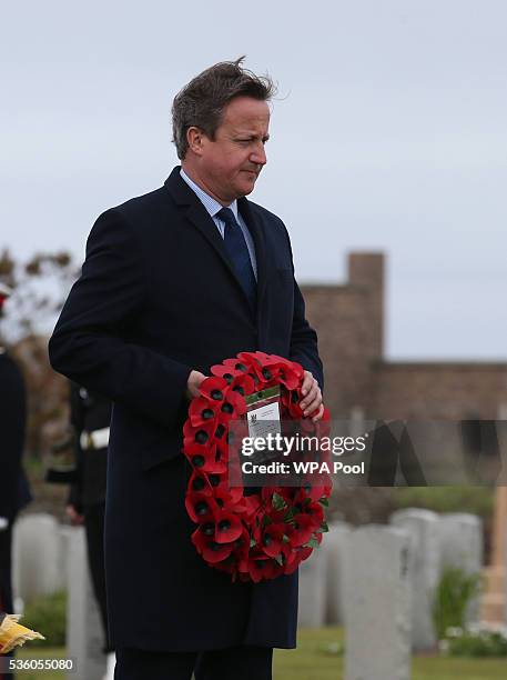 British Prime Minister David Cameron lays a wreath at the Lyness cemetery during the 100th anniversary commemorations for the Battle of Jutland on...