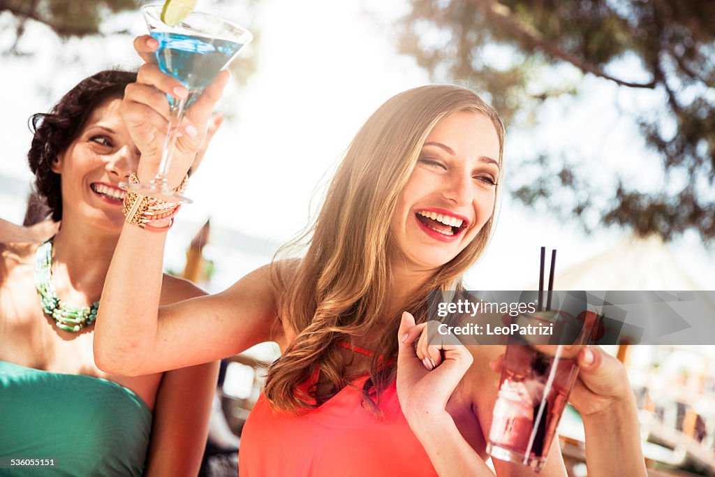 Young friends drinking together