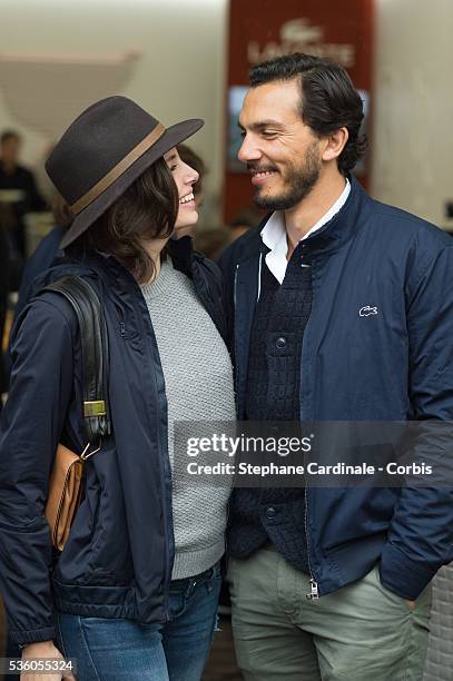 Actress Louise Monot and her companion actor Samir Boitar attends day ten of the 2016 French Open at Roland Garros on May 31, 2016 in Paris, France.