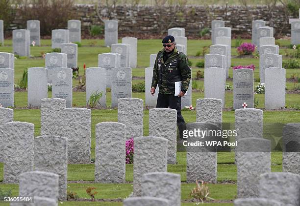 Man looks at graves after attending a service during the 100th anniversary commemorations for the Battle of Jutland on May 31, 2016 in Hoy, Scotland....