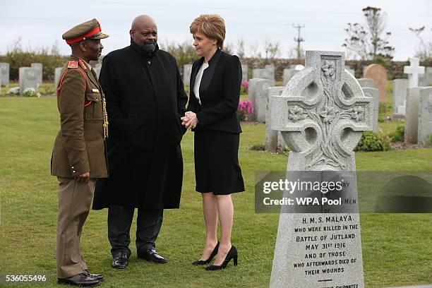 First Minister of Scotland Nicola Sturgeon with Obed Mlaba , South Africa's High Commissioner to the UK, and Brigadier General Mahlobo talk after...