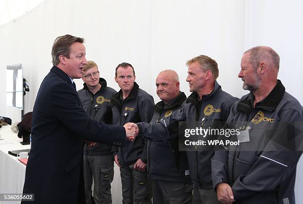 British Prime Minister David Cameron meets gardeners from the Commonwealth War Graves Commission after attending a service during the 100th...