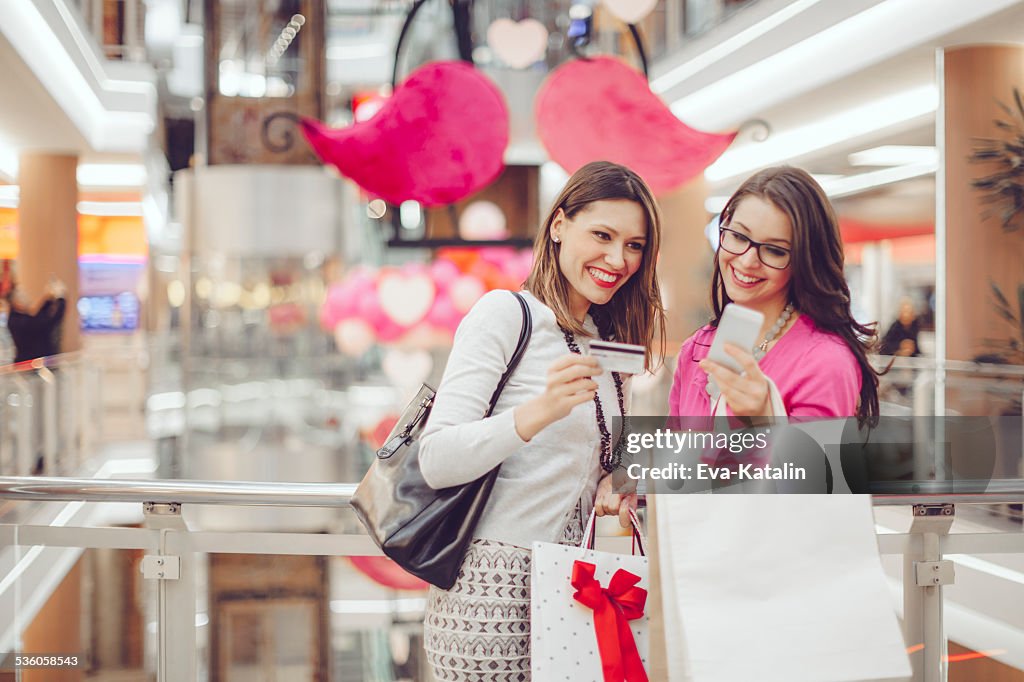 Young women shopping together in a shopping mall
