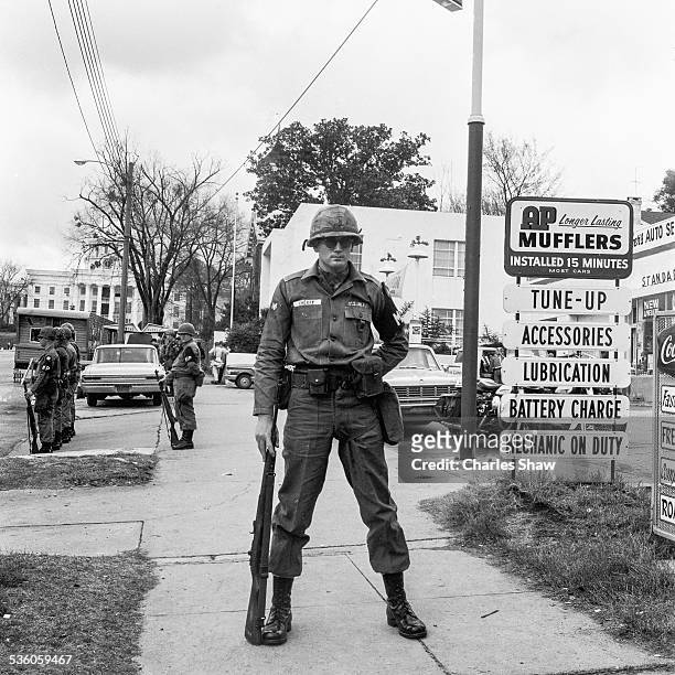 Army MPs stand guard on Dexter Avenue on the day that the Selma to Montgomery March arrived at the Alabama State Capitol later in the day,...