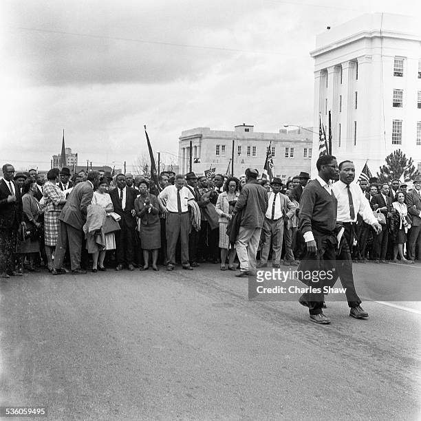 At the culmination of the Selma to Montgomery March, American religious and Civil Right leader Martin Luther King Jr and Bernard Lee of the Student...