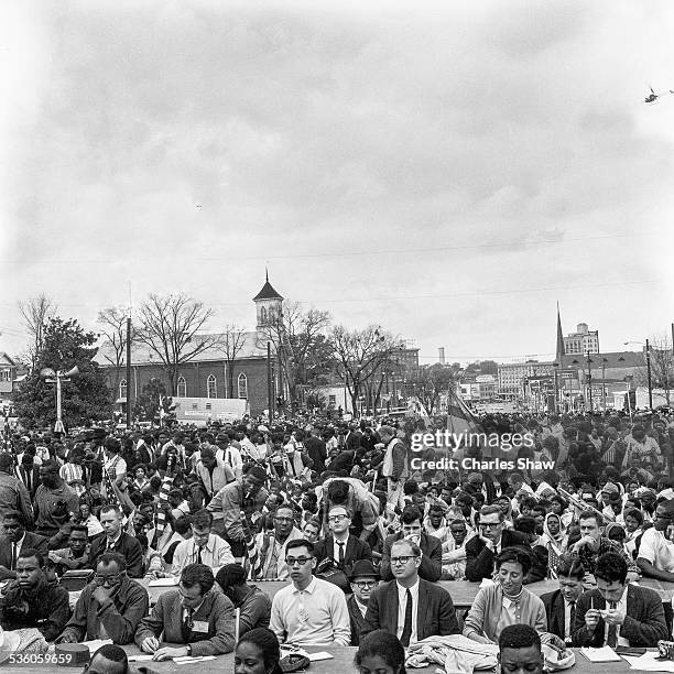 View down Dexter Avenue across press tables at the end of the Selma to Montgomery March, Montgomery, Alabama, March 25, 1965. The Dexter Avenue...