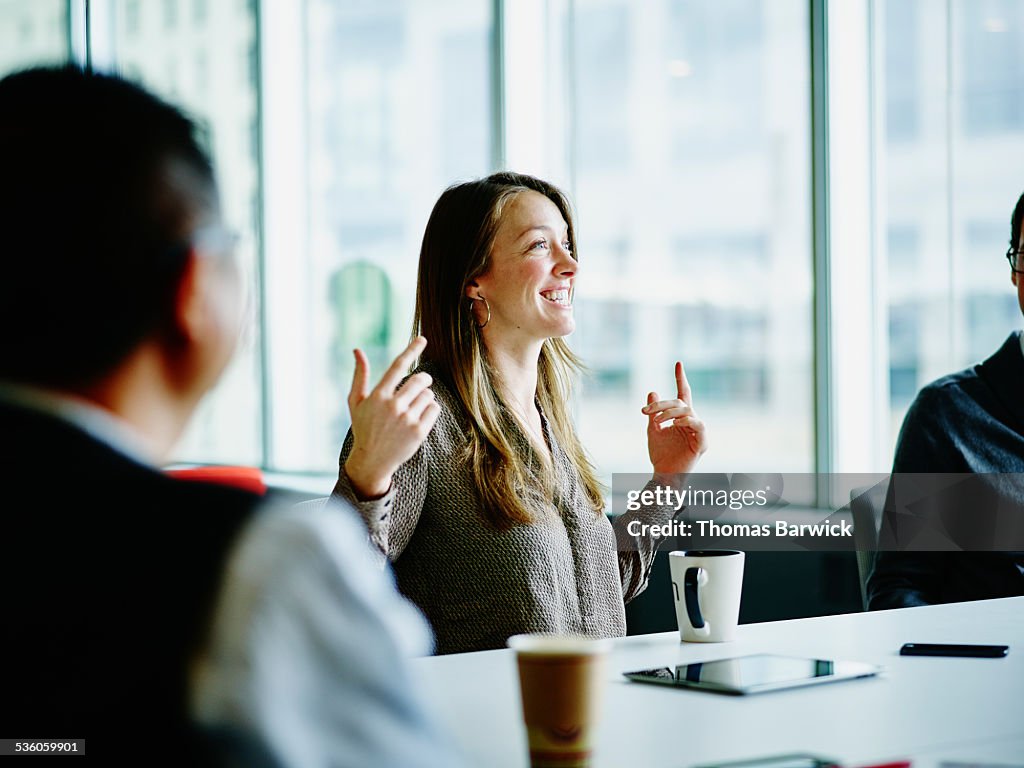 Smiling businesswoman leading project meeting