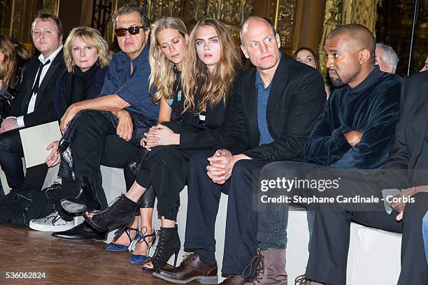 James, guest, Mario Testino, Poppy Delevingne, Cara Delevingne, Woody Harrelson and Kanye West attend the Stella McCartney show as part of the Paris...