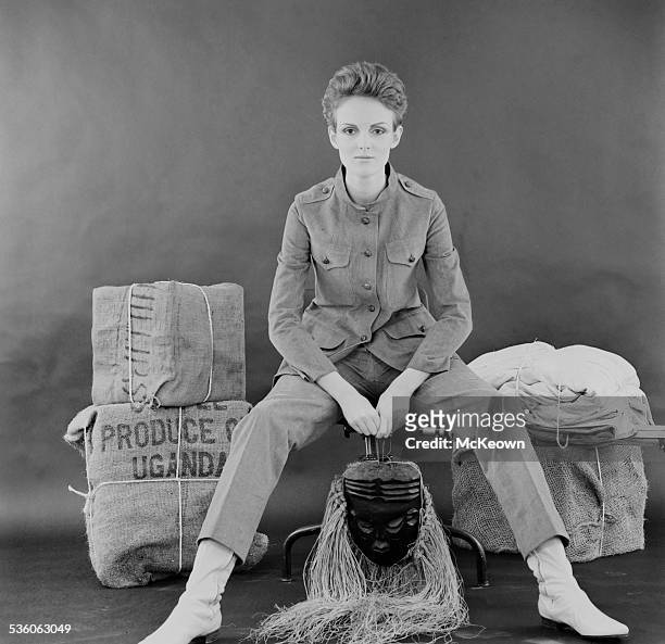 British fashion model Grace Coddington shows a safari pant suit and boots, 1967.